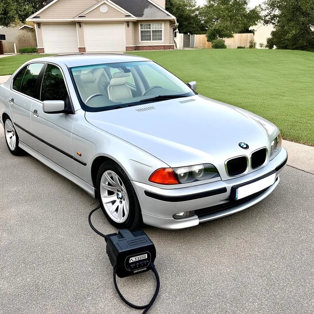 BMW E39 with a Bluetooth OBD2 reader plugged in