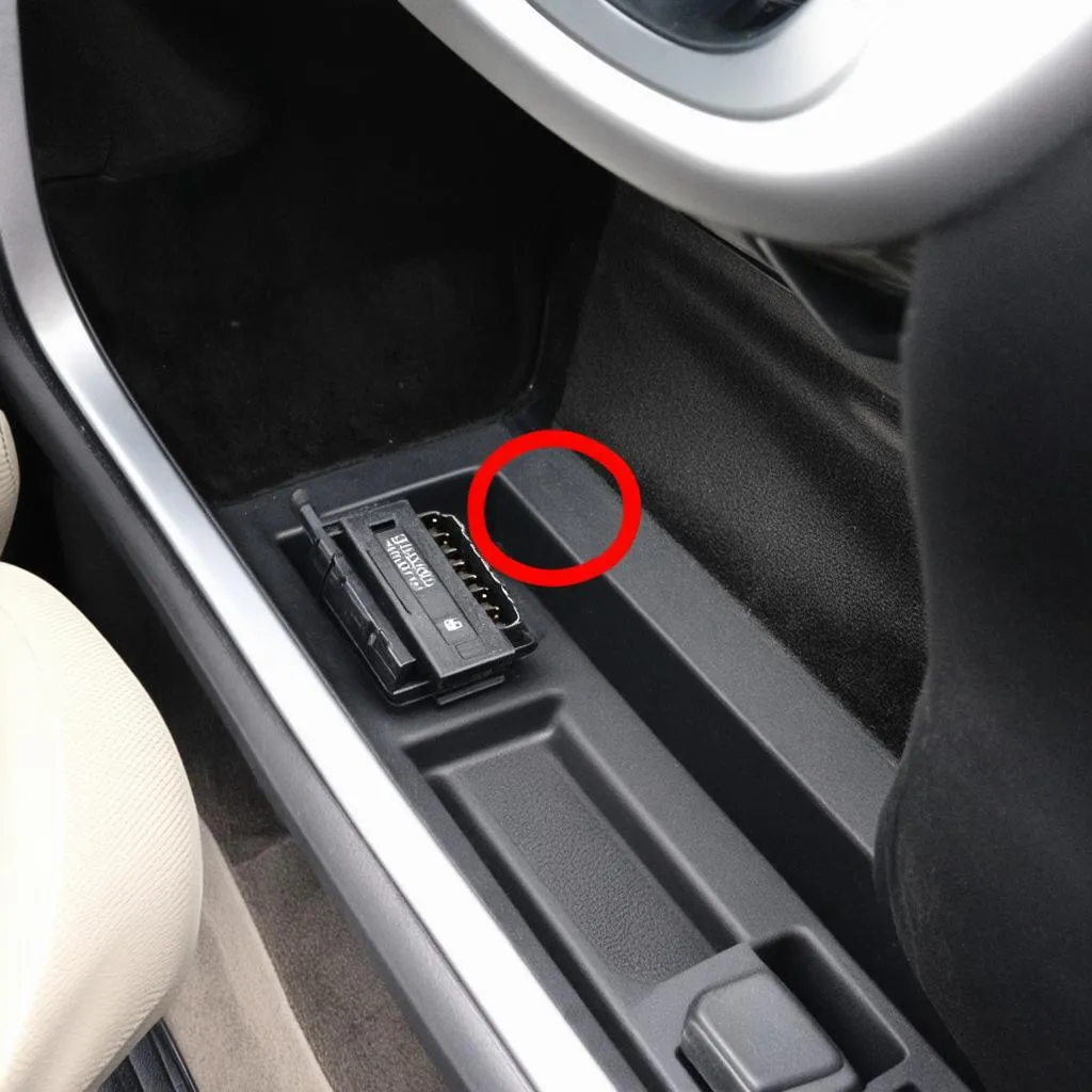 OBD port location under the dashboard of a car