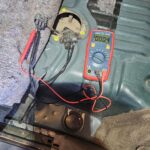 Testing for voltage at fuel pump connector blue-orange wire on a 1997 4Runner, showing no voltage reading which indicates a potential electrical issue preventing fuel delivery.