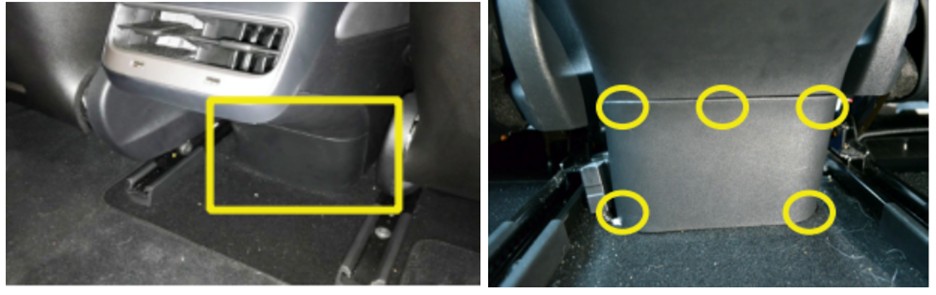 Removing the rear center console panel to access the OBD2 port in a Tesla Model 3.