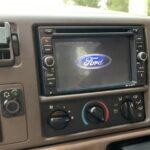 Aftermarket double din radio installed in a 2006 Ford F150 dashboard, showcasing the integrated look.