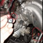 Connectors above alternator and throttle body on B18B1 OBD2 engine, likely related to engine harness wiring.