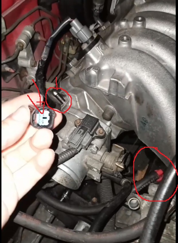 Connectors above alternator and throttle body on B18B1 OBD2 engine, likely related to engine harness wiring.