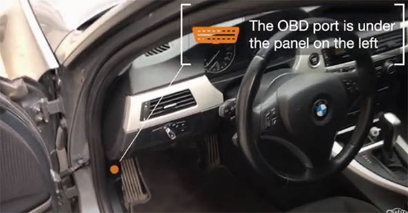 OBD2 port location under the dashboard of a car