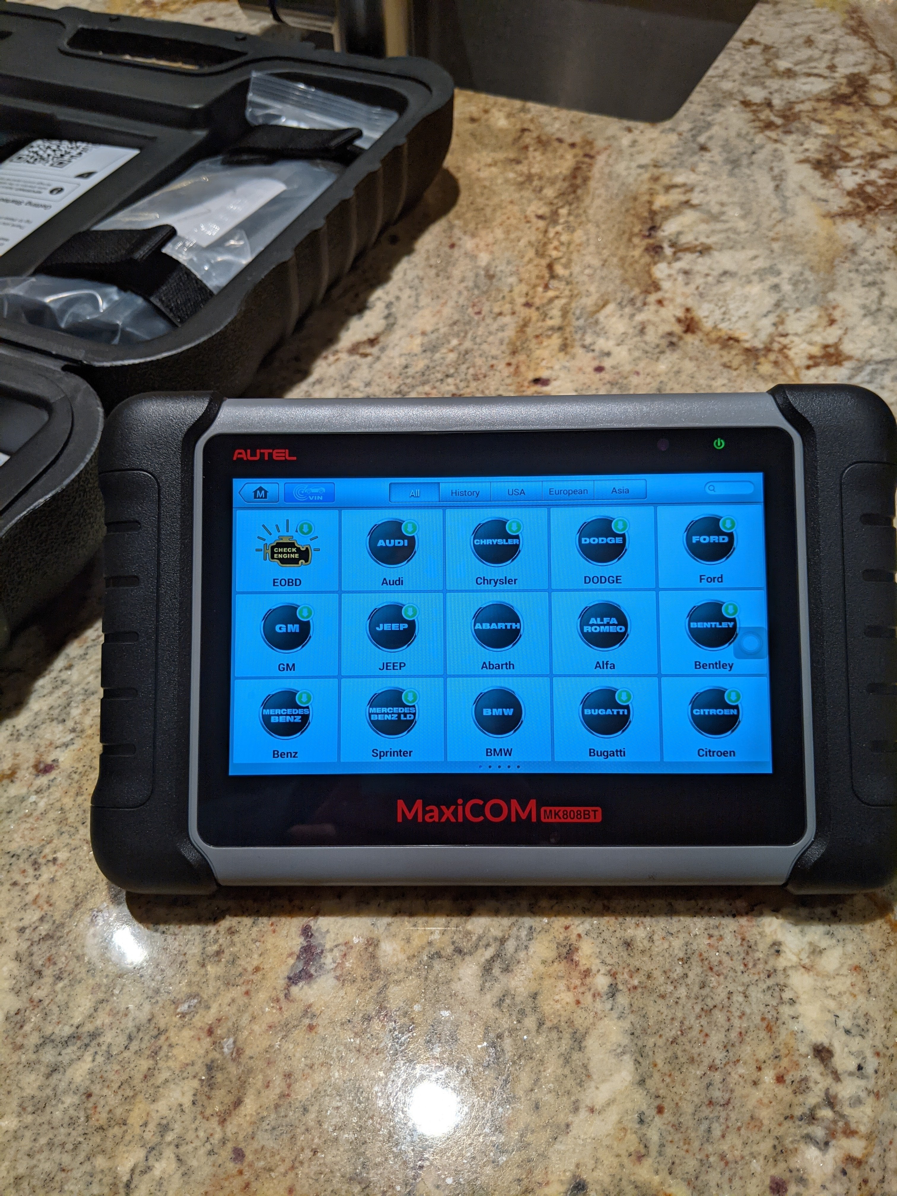 Autel MaxiCOM MK808 tablet-style car diagnostic tool displaying vehicle data