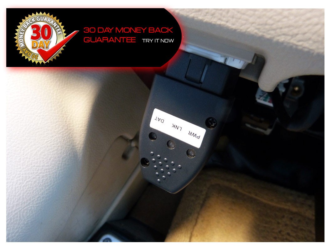 OBD2 performance chip module installed in a vehicle's OBD2 port, highlighting its plug-and-play nature for easy installation in Freightliner trucks, specifically the 2011 DD13 model.