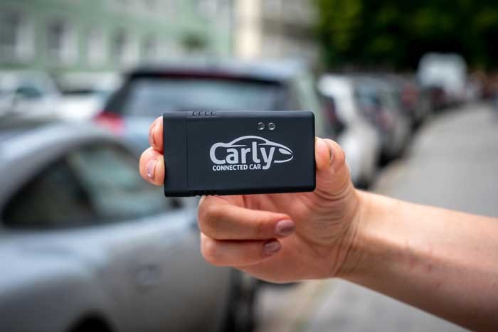 Carly OBD reader connected to OBD2 port